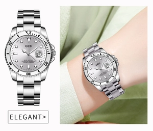 Detailed view of silver stainless steel business watch with date display and rotating bezel