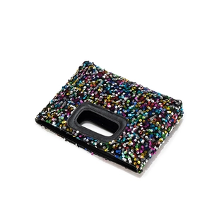 Rainbow sequin square handbag with black oval handles and vibrant multi-color patchwork