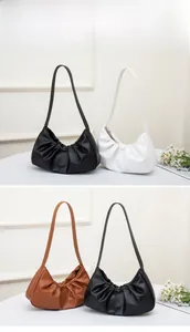 Three pleated dumpling shoulder bags displayed in black, white, and brown classic colors