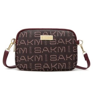 Classic dark brown patterned crossbody bag with gold-tone hardware and double zippers