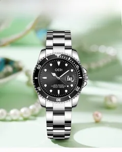 Macro detail of men's stainless steel watch featuring a black bezel and date magnifier