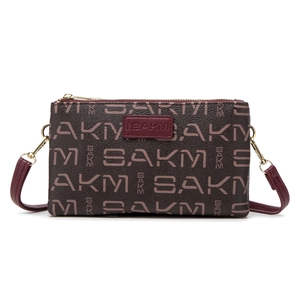Vintage burgundy monogram double-zipper clutch bag with gold-tone hardware and strap
