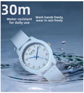 Close-up of light blue waterproof quartz watch in splashing water ripples detail