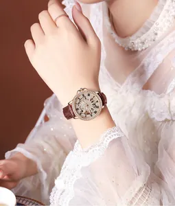 Elegant skeleton dial watch with Roman numerals and crystal bezel on leather strap