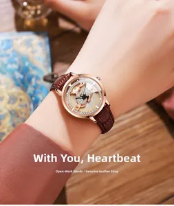 Detail of rose gold quartz watch featuring a deer pattern dial and brown leather strap