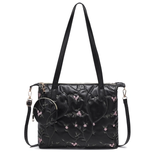 Quilted black tote bag set with floral embroidery and detachable round coin purse charm