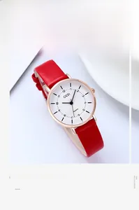 Close-up of GEDI women's fashion quartz watch with red leather strap and gold case