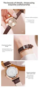 Detailed view of the rose gold steel case and textured brown leather strap on women's watch