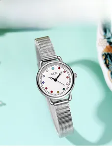 Close-up of elegant silver watch dial featuring twelve colorful birthstone crystals