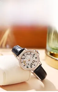 Detail of rose gold skeleton watch dial with diamond accents and black leather strap