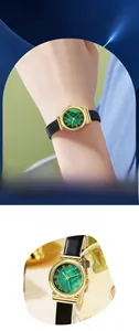 Macro detail of vintage watch featuring malachite green dial and elegant gold bezel