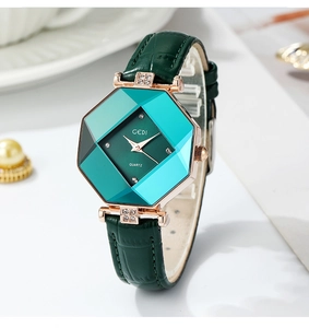 Macro view of octagon women watch with dark green dial and rose gold rhinestone details