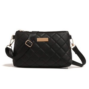 Black quilted rhombic pattern crossbody bag with adjustable strap and gold hardware