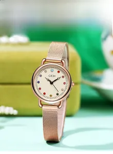 Detail of rose gold mesh watch band with twelve colorful birthstone hour markers