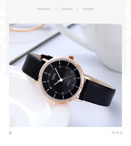 Detailed view of women's quartz watch with black leather strap and rose gold metal case