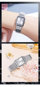 Close-up of a silver rectangular quartz watch with Roman numerals and an elastic metal band