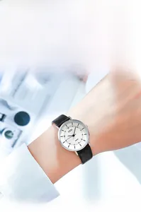 Detail view of a classic GEDI quartz watch with white Roman dial and slim black leather strap