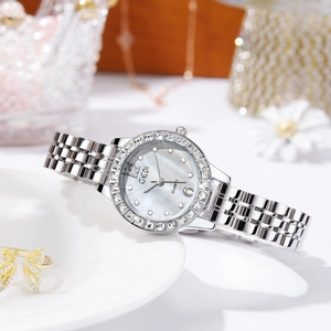 Elegant silver women watch with mother of pearl dial and sparkling rhinestone bezel