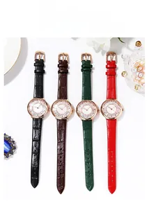 Detail of four luxury women's quartz watches with embossed leather straps and crystal bezels