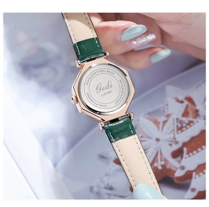 Detail view of Gedi octagonal watch stainless steel back and green leather strap