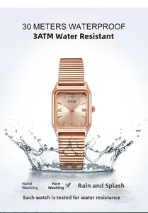 Macro shot of waterproof rose gold square watch with roman numerals and splash effect