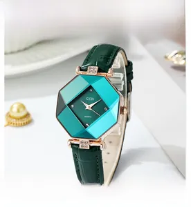 Close-up of octagonal emerald green dial with rose gold bezel and crystal accents