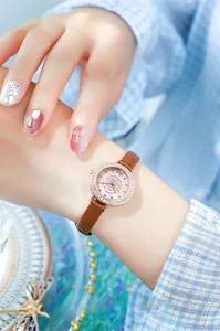 Women's rose gold watch with rhinestone bezel, floral dial and brown leather strap