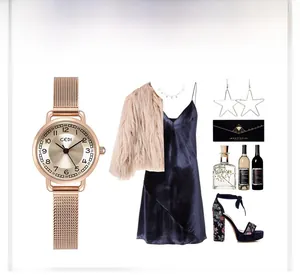 Détails de la montre en or rose avec bracelet en maille et cadran à chiffres arabes