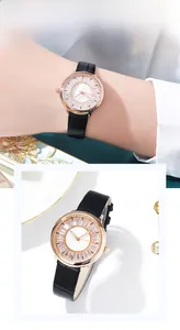 Detail of a ladies' quartz watch with black leather strap and starburst crystal dial