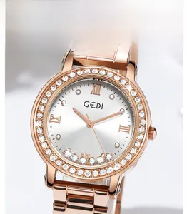 Detail of rose gold stainless steel watch featuring a crystal bezel and floating diamonds
