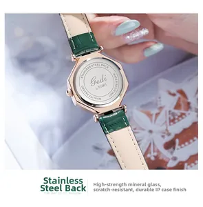 Detail of Gedi octagon watch featuring stainless steel back and green leather strap