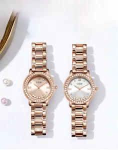 Detailed view of rose gold quartz watches with crystal bezel and steel strap