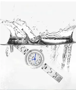 Detailed shot of GEDI silver quartz watch submerged in water showing 3ATM waterproof feature