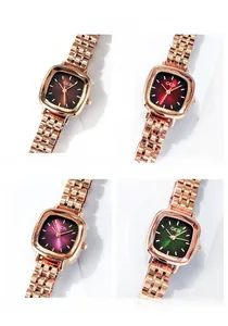 Detail of square quartz watch dials in brown red purple and green colors
