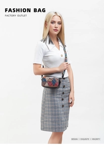 Detail of multi-color quilted crossbody bag with patterned wide strap and LOVE print