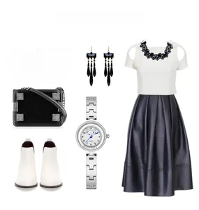 Flat lay of a GEDI silver steel bracelet watch with a chic black and white fashion outfit