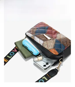 Practical internal storage of quilted patchwork crossbody bag showing daily essentials