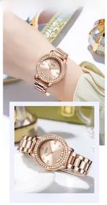 Detail view of women's rose gold starry watch with rhinestone bezel and metal link strap
