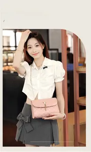 Detail of pink quilted leather shoulder bag with gold chain strap and pearl buckle
