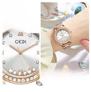 Macro detail of rose gold quartz watch with rhinestone bezel and starry dial design