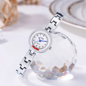 Elegant silver GEDI quartz watch with white dial and blue hands on crystal prop