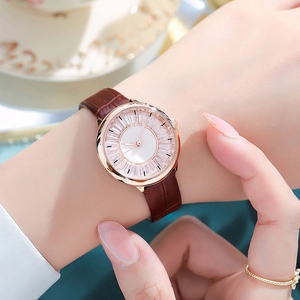 Elegant ladies rose gold quartz watch with diamond bezel and brown crocodile leather strap