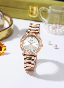 Macro shot of rose gold watch dial featuring five floating diamonds and luxury GEDI branding