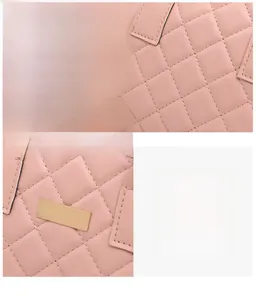Detail of pink quilted leather texture and premium gold metal hardware on the handbag
