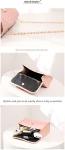 Detail of pink quilted handbag showing gold chain strap and spacious interior capacity