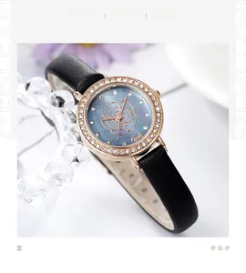 Detailed macro view of the rose gold bezel with rhinestones and floral dial on women's watch