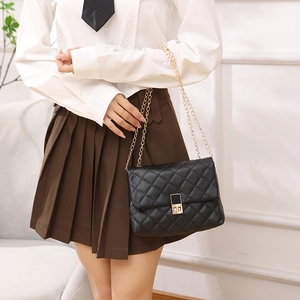 Classic black quilted chain shoulder bag with gold hardware for stylish women's casual wear