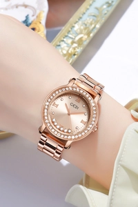 Wrist view of GEDI rose gold watch with rhinestone bezel and floating dial diamonds