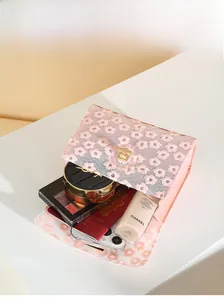 Internal view of pink lace flower bag showing space for phone and cosmetics