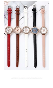 Flat lay of colorful leather strap watches featuring floral dials and diamond bezels